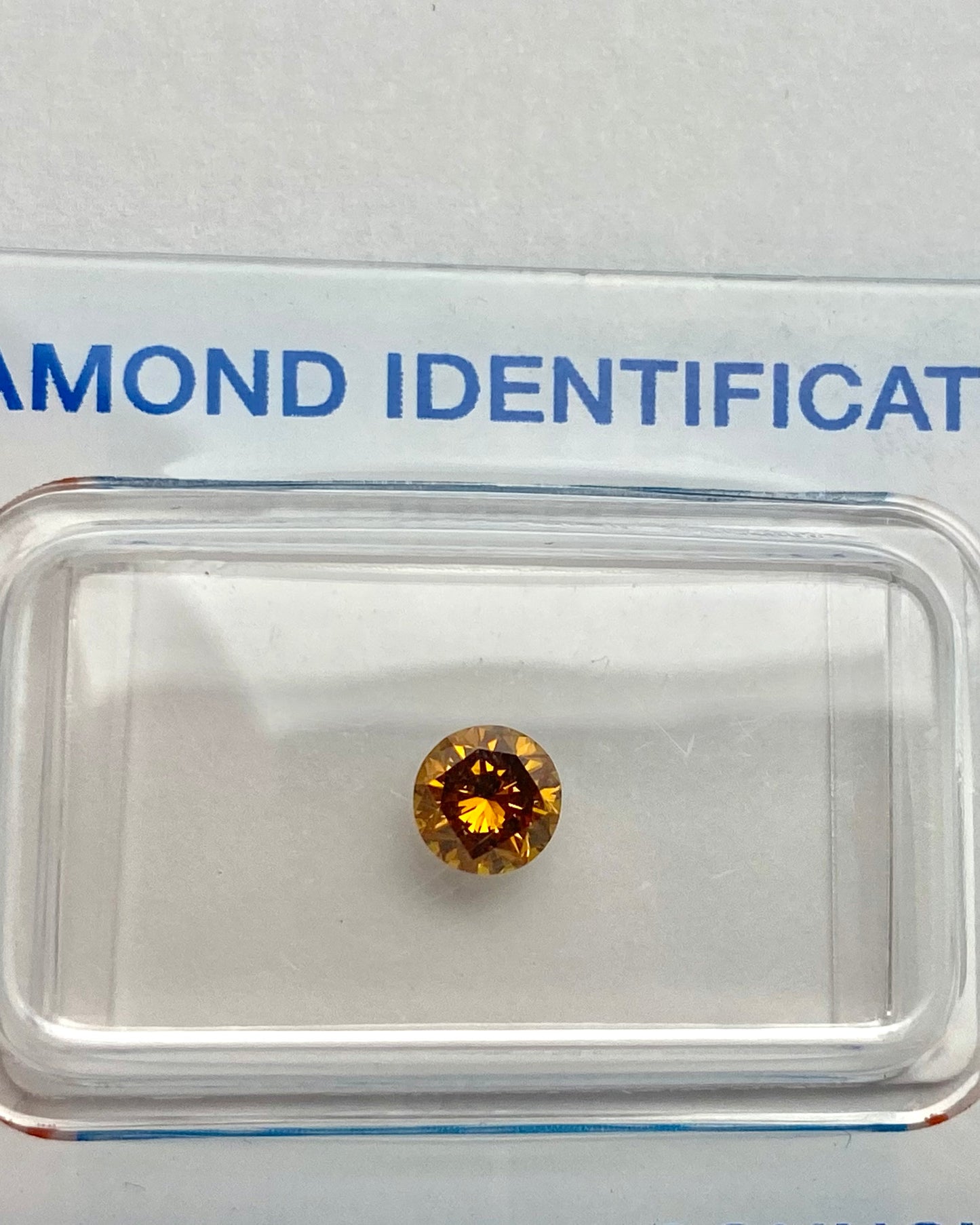 Natural Round 0.58ct Orange Brown SI2